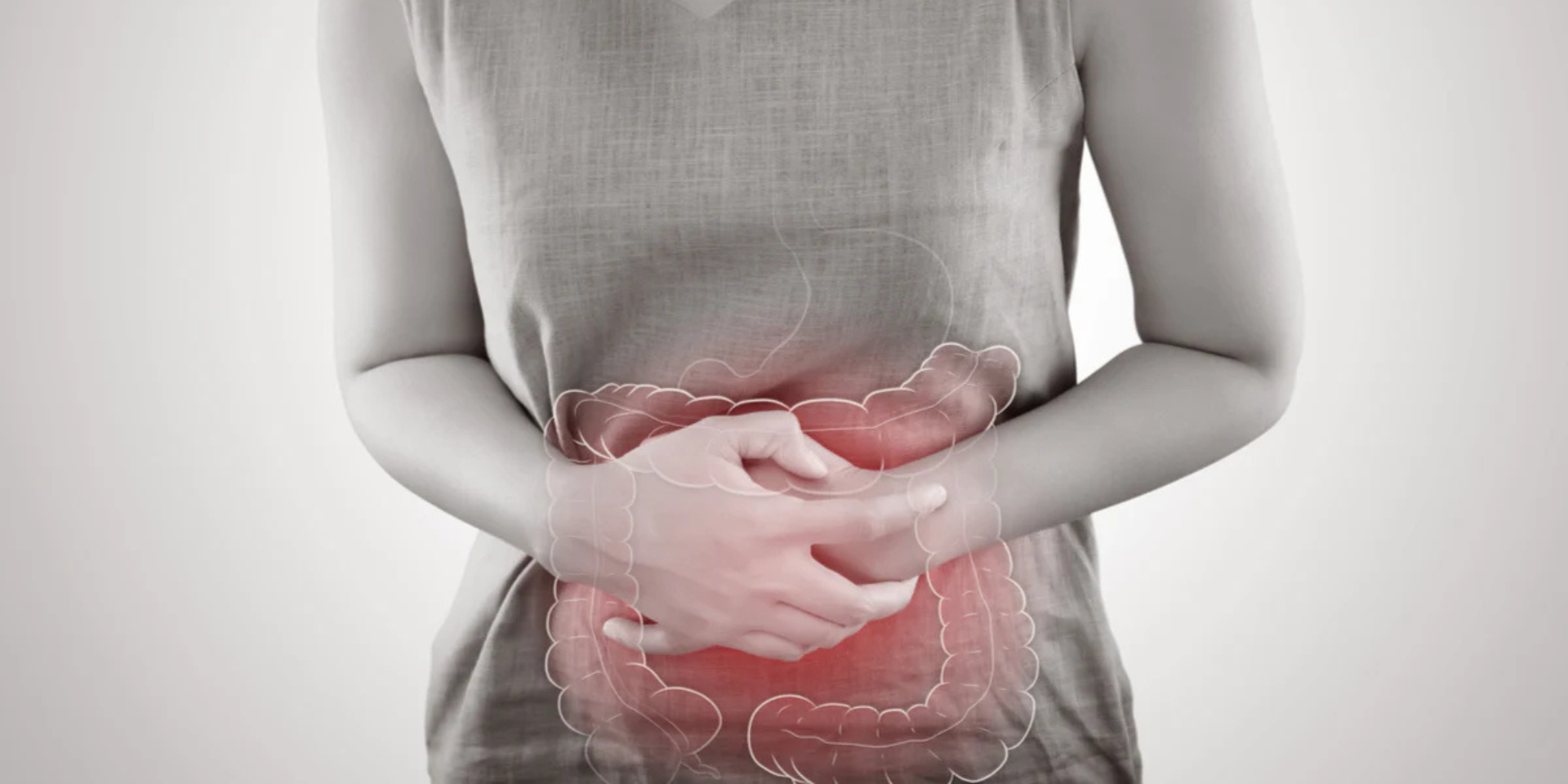 Person holding lower abdomen with translucent colon overlay highlighted red to indicate constipation pain.