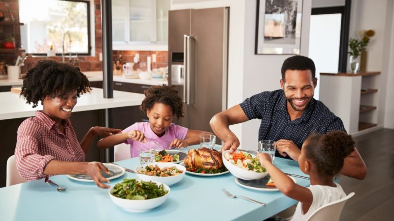 Family with children eating a home-cooked meal